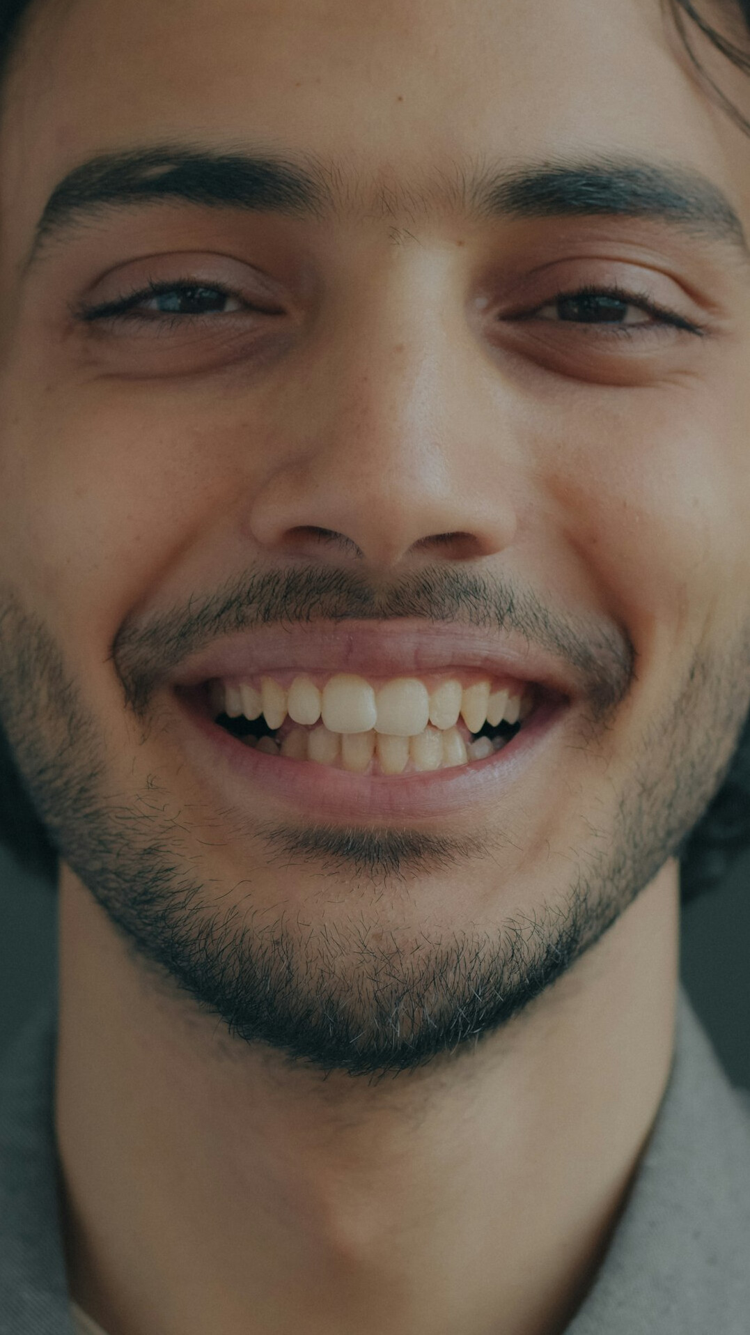 Portrait of a smiling male mentor with short beard
