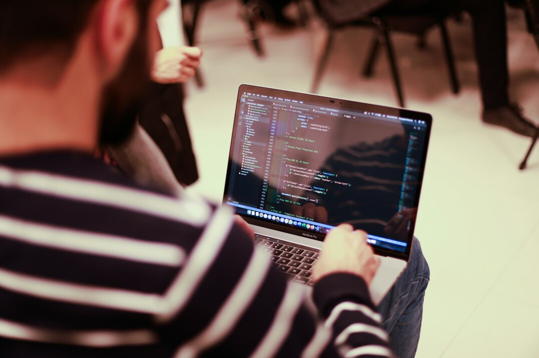 programmer working on laptop