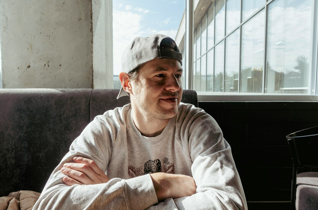 Portrait of a smiling young male mentor